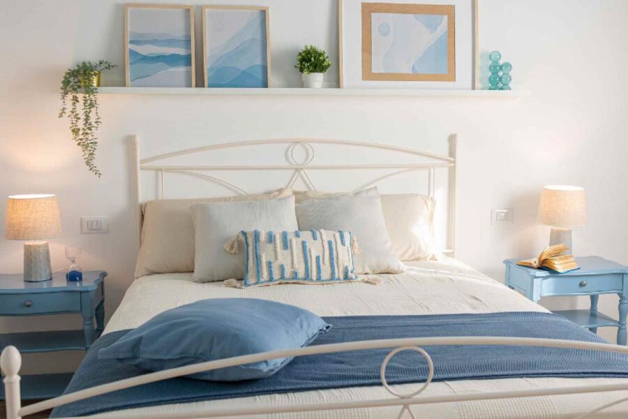 Cozy and stylish bedroom at Villa Blue Oasis, a Sicily luxury villa featuring soft blue and white tones, elegant décor, and a serene ambiance.