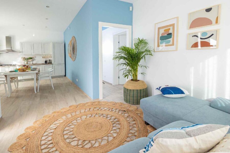 Bright and modern living space at Villa Blue Oasis, a stunning Sicily luxury villa with elegant décor, a cozy lounge, and a fully equipped kitchen.