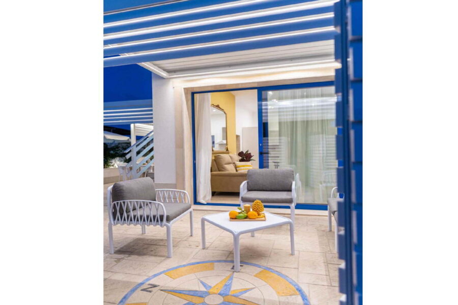 Charming outdoor lounge at Villa Blue Oasis, a Sicily luxury villa with modern décor, cozy seating, and Mediterranean accents, perfect for relaxation.