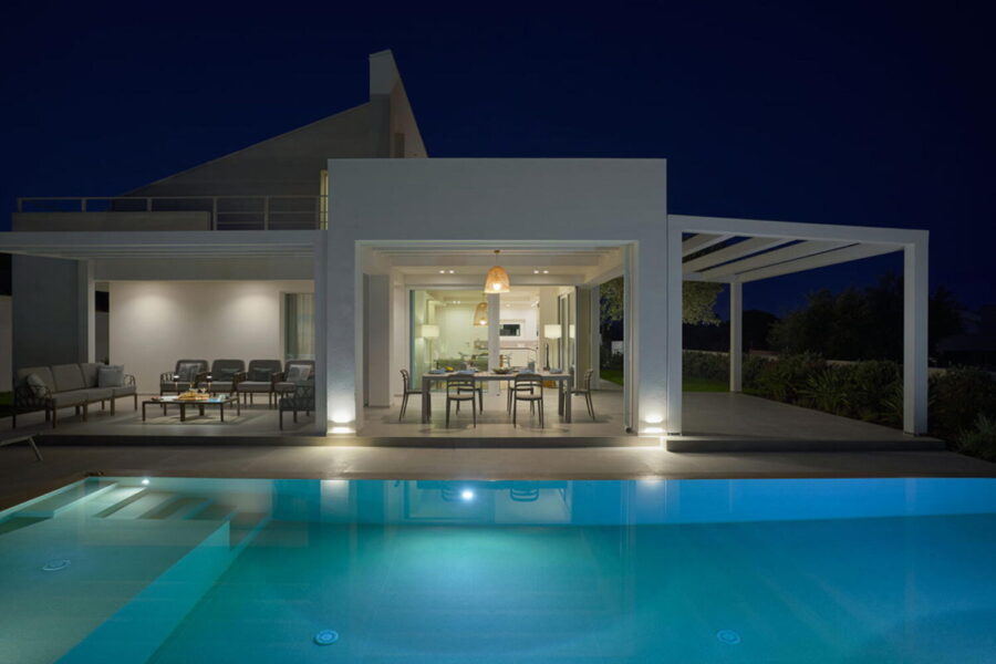 Azure Essence luxury villa in Sicily illuminated at night by the pool